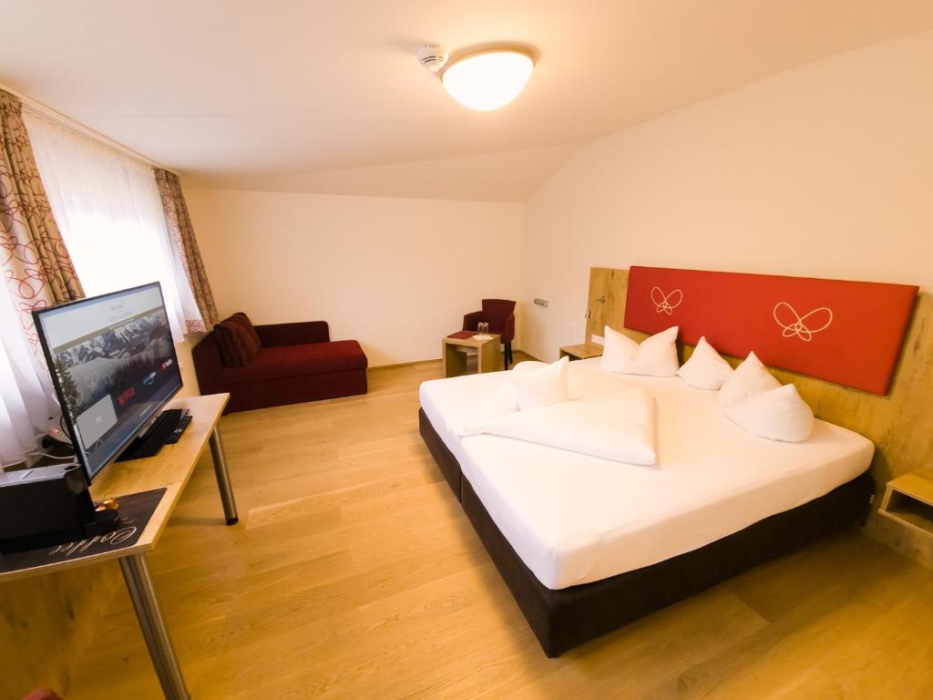 Postelja oz. postelje v sobi nastanitve Das Alpin - Hotel Garni Guesthouse