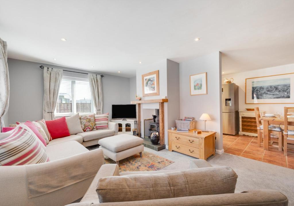 a living room with a couch and a table at Seafarers in Seahouses