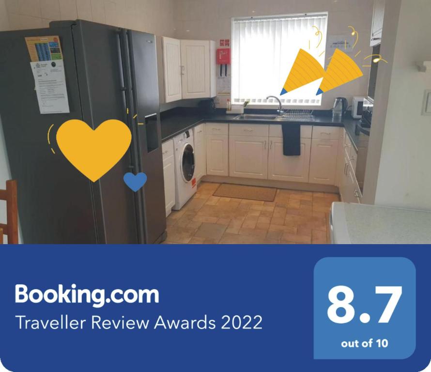 a kitchen with a refrigerator with a heart on it at Spacious Luxurious Serviced Accomodation in Doncaster