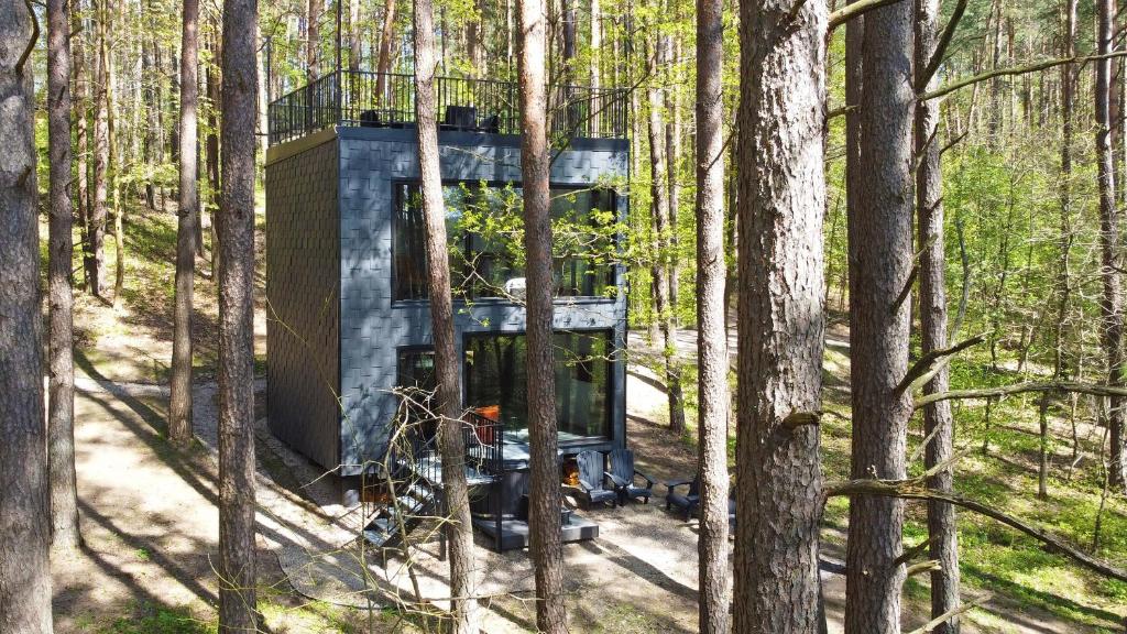 a tree house in the middle of the woods at Premium Forest Bungalow with Ofuro Tub in Luokesos Sen