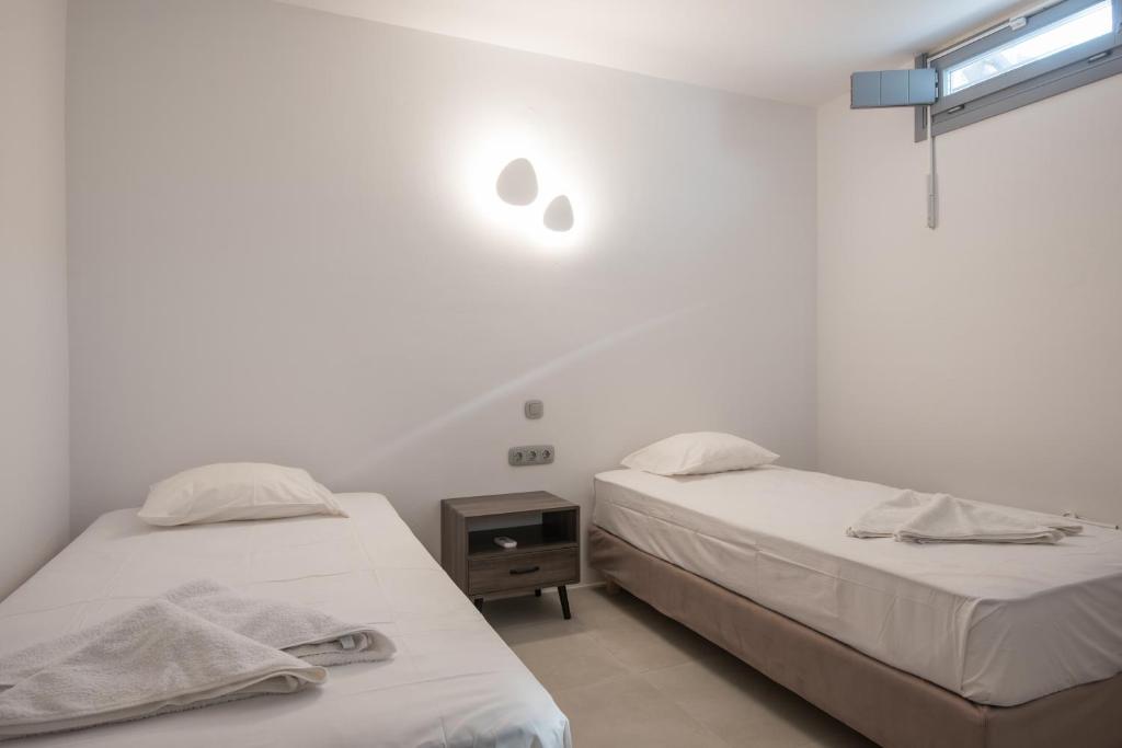 Posteľ alebo postele v izbe v ubytovaní Seaview Villa Euterpe