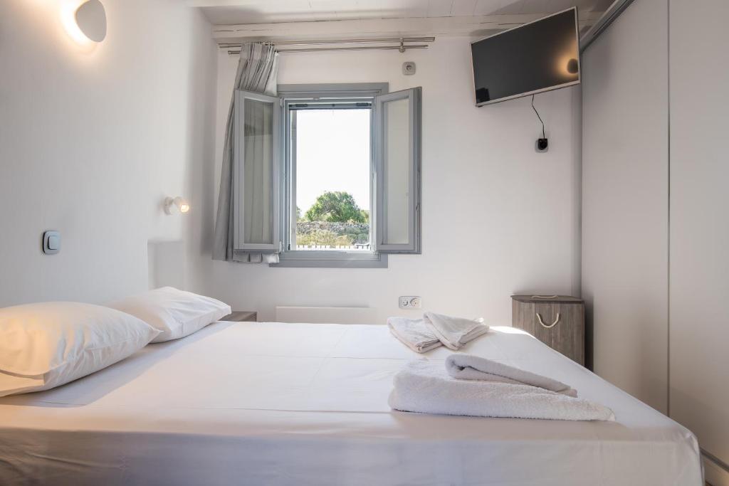 Posteľ alebo postele v izbe v ubytovaní Seaview Villa Euterpe