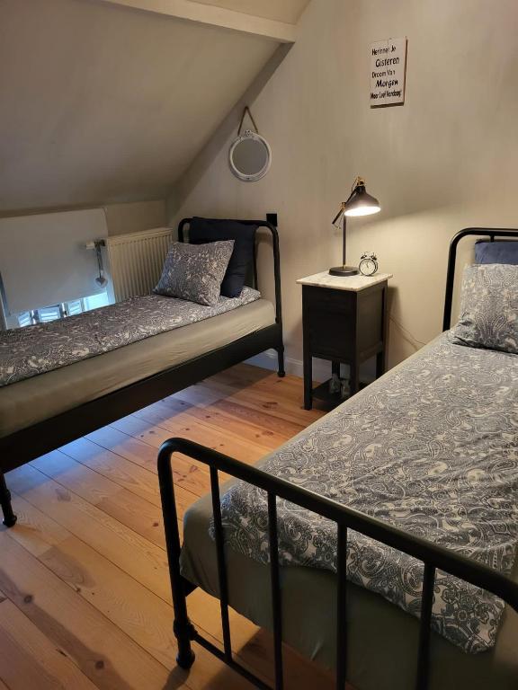 Postel nebo postele na pokoji v ubytování Welness gastenverblijf Carpe Diem