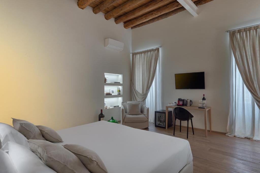Postel nebo postele na pokoji v ubytování Massimago Wine Suites