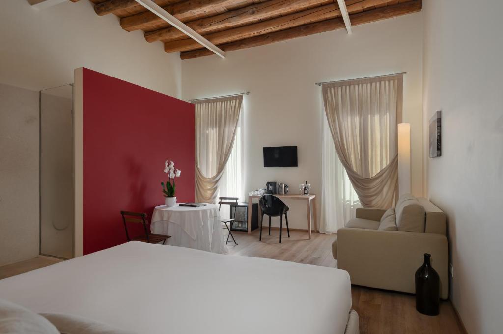 Postel nebo postele na pokoji v ubytování Massimago Wine Suites