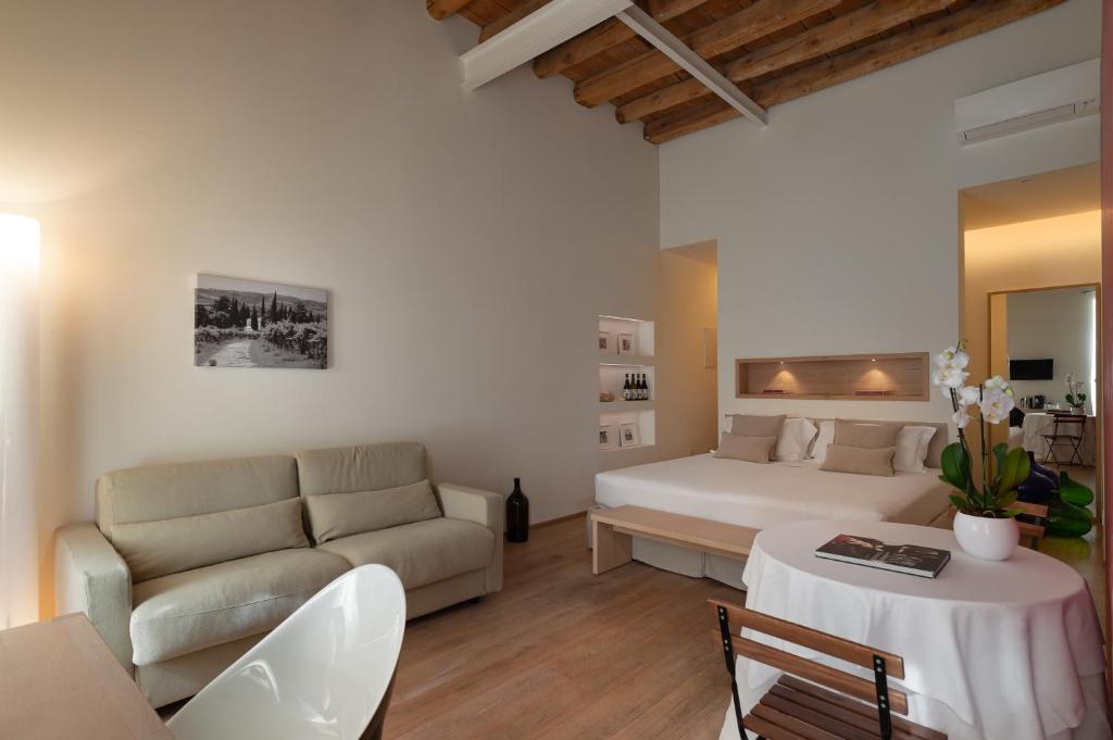 Postel nebo postele na pokoji v ubytování Massimago Wine Suites