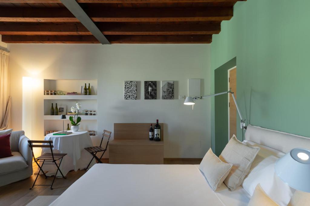 Postel nebo postele na pokoji v ubytování Massimago Wine Suites