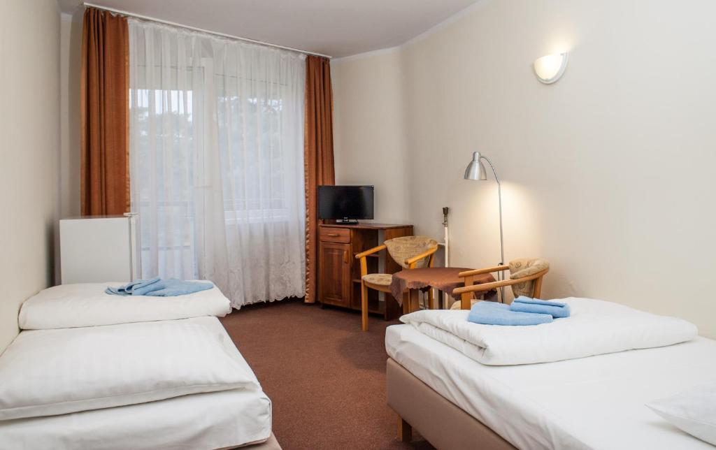 Postel nebo postele na pokoji v ubytování OSW Kaper