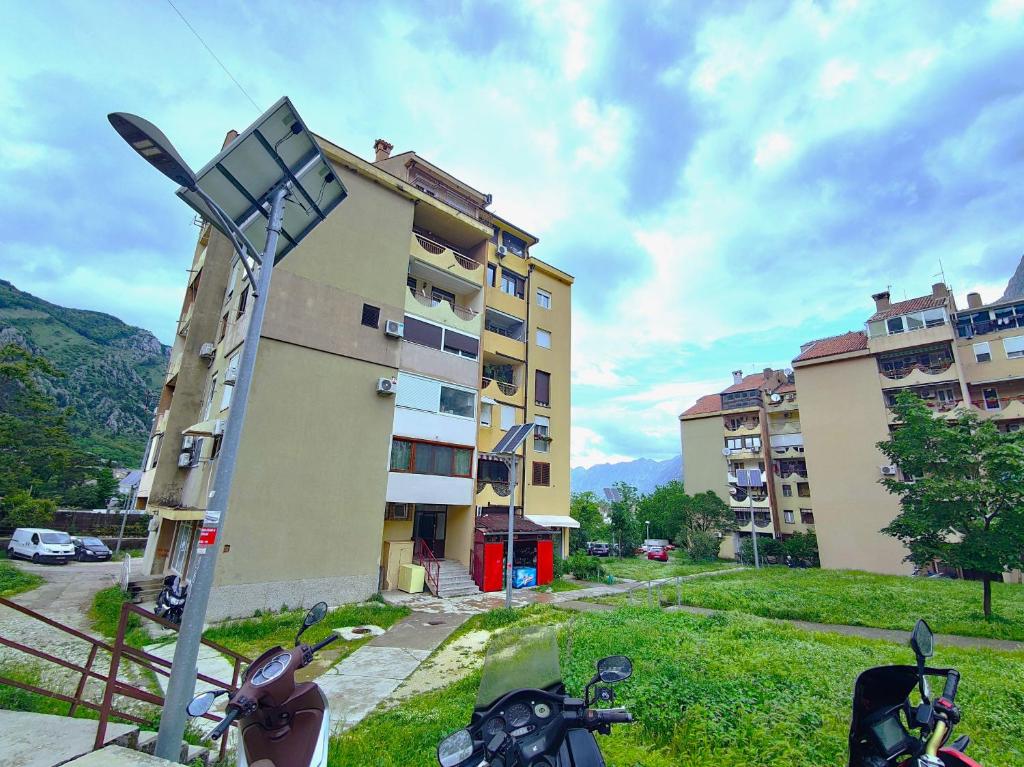 a group of motorcycles parked in front of a building at Apartment City View in Kotor