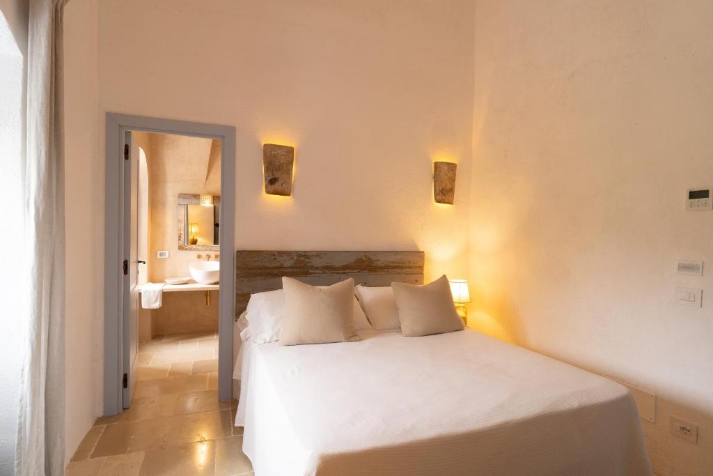 Postel nebo postele na pokoji v ubytování Masseria Soluco