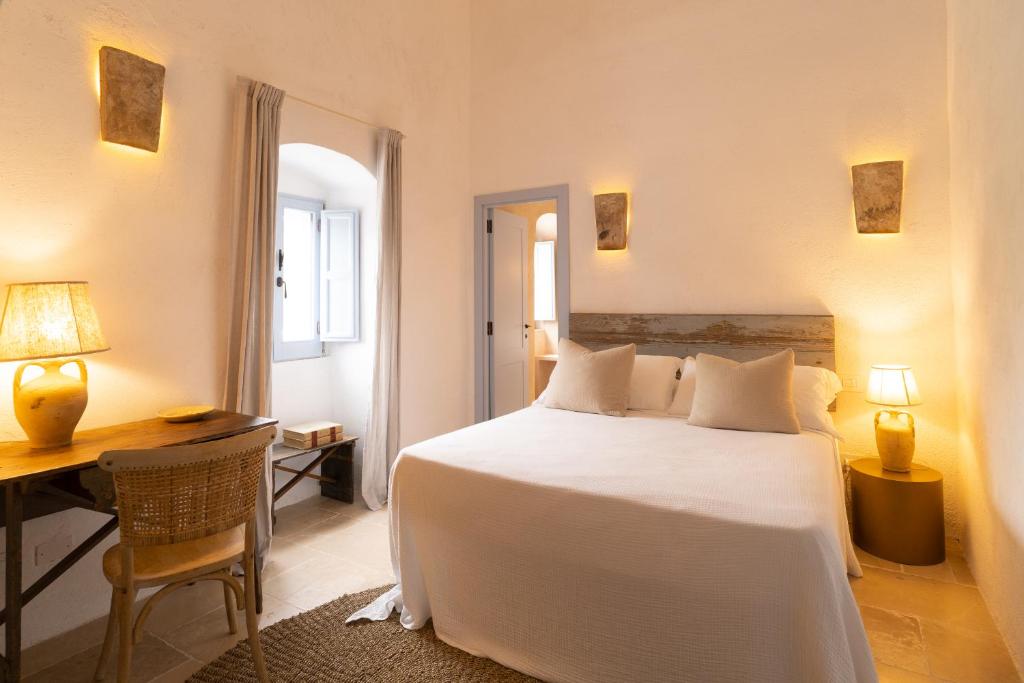 Postel nebo postele na pokoji v ubytování Masseria Soluco