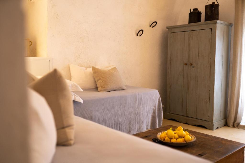 Postel nebo postele na pokoji v ubytování Masseria Soluco