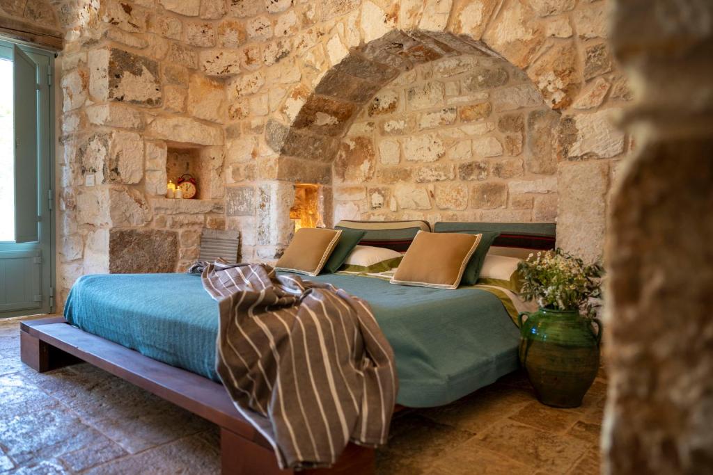 Posteľ alebo postele v izbe v ubytovaní Ostuni Art Resort