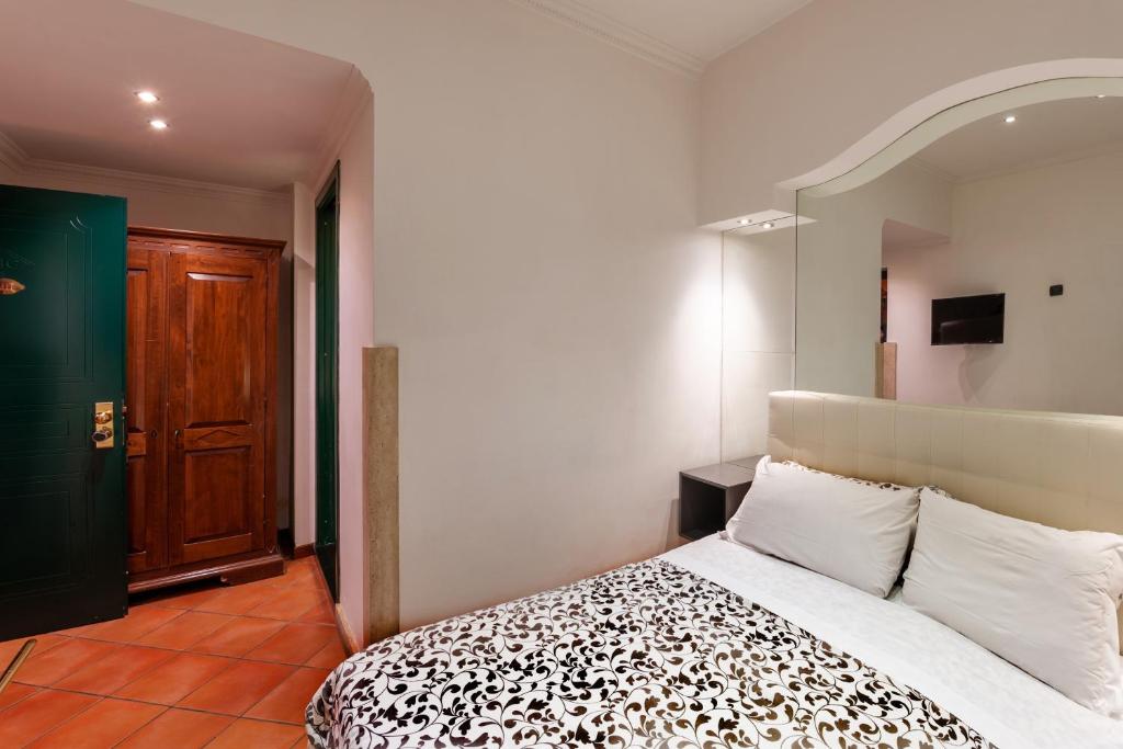 Cama ou camas em um quarto em Hotel Canova