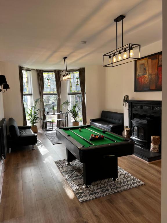 a living room with a pool table in it at No.1 Beechcroft in Liverpool