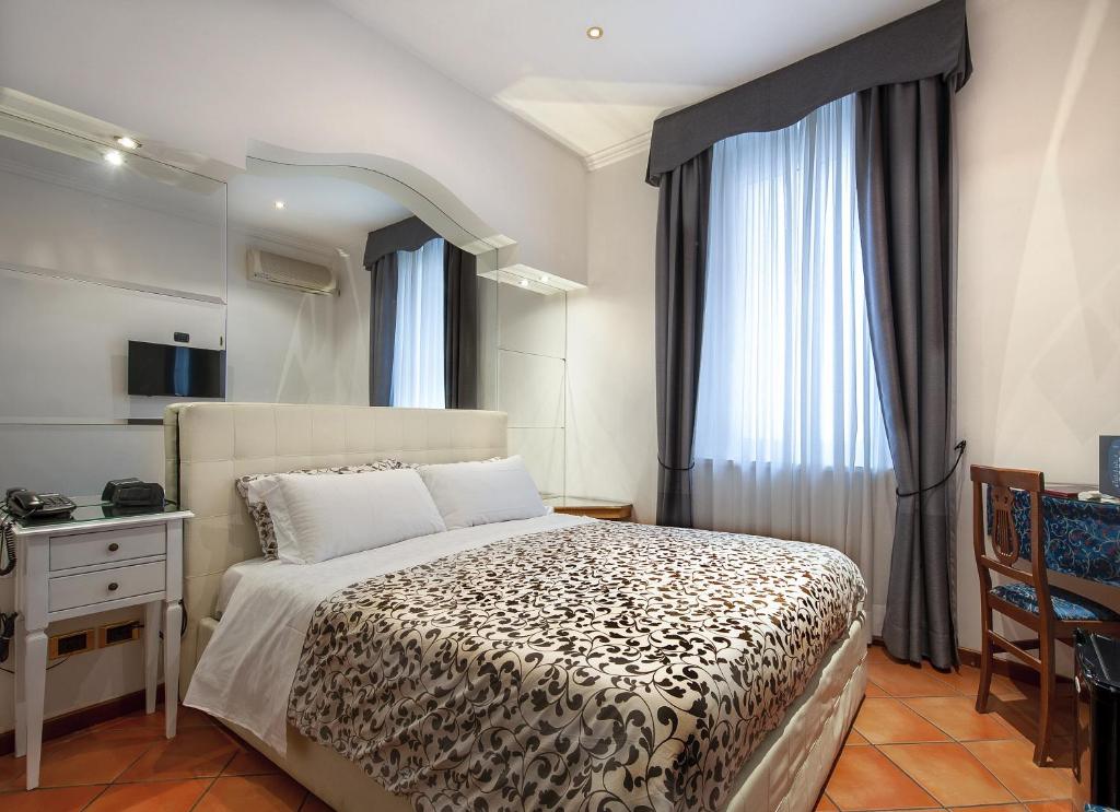 Cama ou camas em um quarto em Hotel Canova