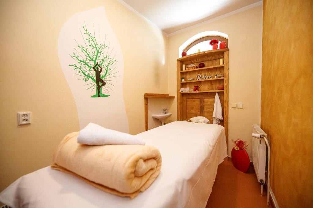 Postel nebo postele na pokoji v ubytování Wellness Pension 7