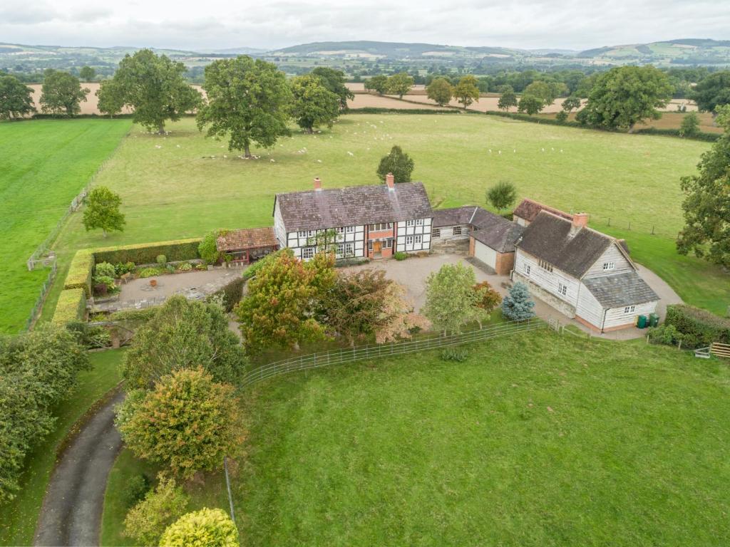 an aerial view of a house in a field at Bearwood House & Cottage in Pembridge