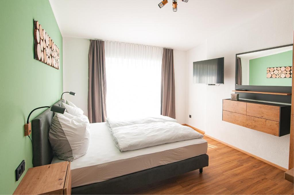 Postel nebo postele na pokoji v ubytování MK Appartements