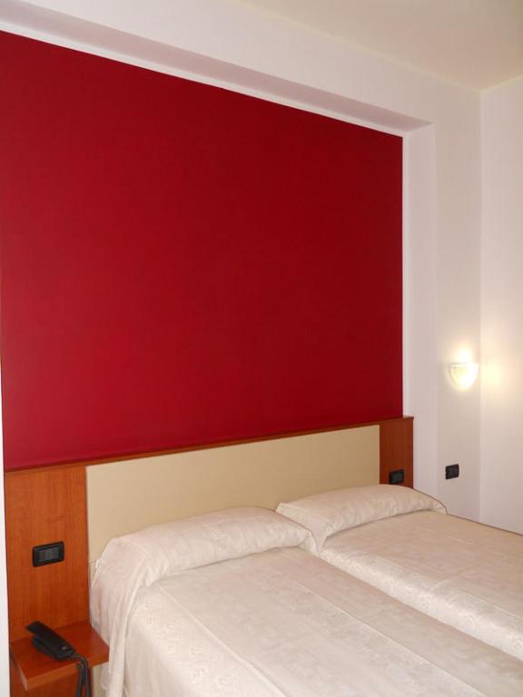 Postel nebo postele na pokoji v ubytování Eco Art Hotel Statuto
