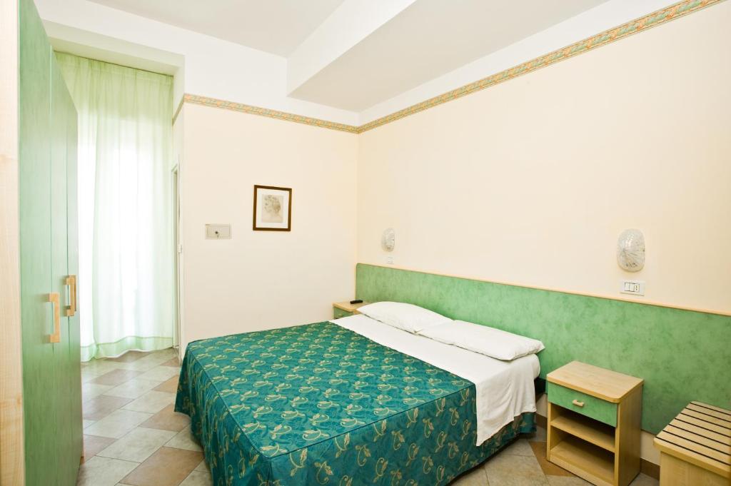 Postel nebo postele na pokoji v ubytování Hotel Giamaika