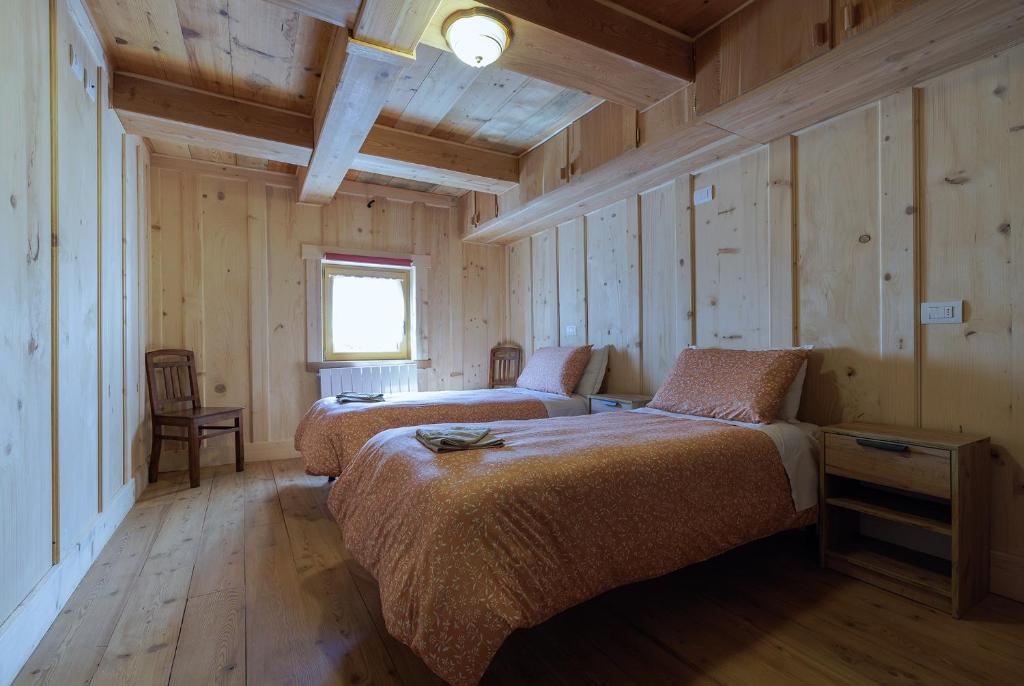 Postel nebo postele na pokoji v ubytování La WalserHus