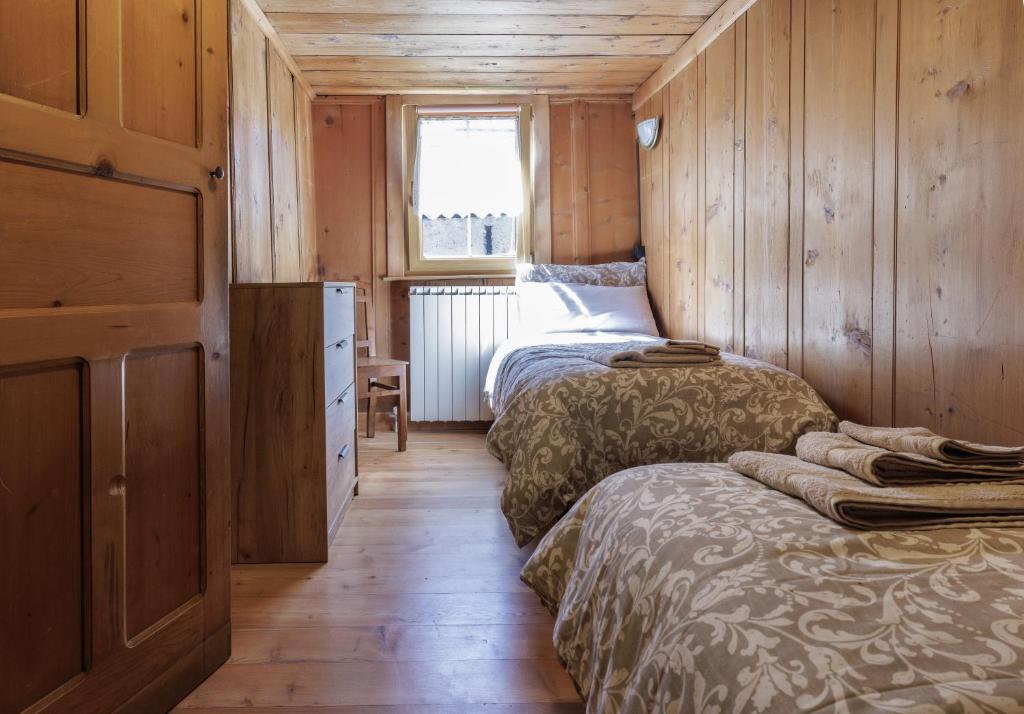 Postel nebo postele na pokoji v ubytování La WalserHus