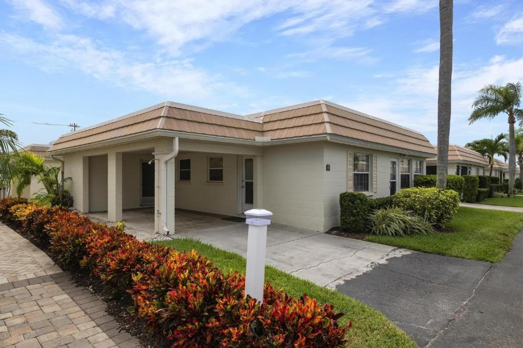 a small house with a pathway in front of it at Island House Beach Resort 19 in Point O'Rocks