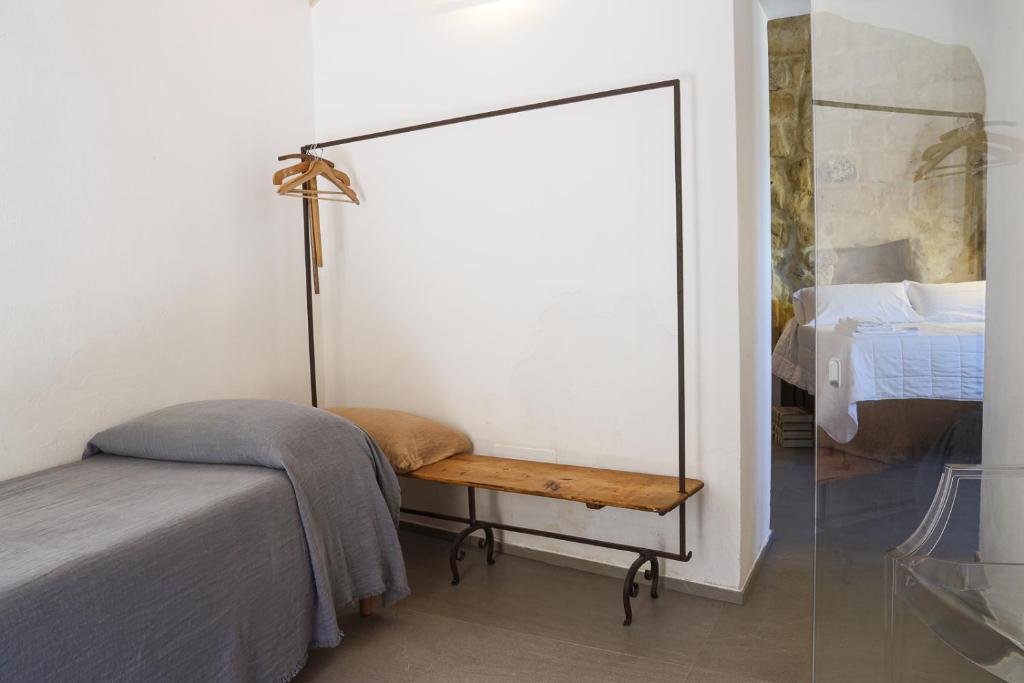 Postel nebo postele na pokoji v ubytování Il Carrubo residenza Walk&Stay