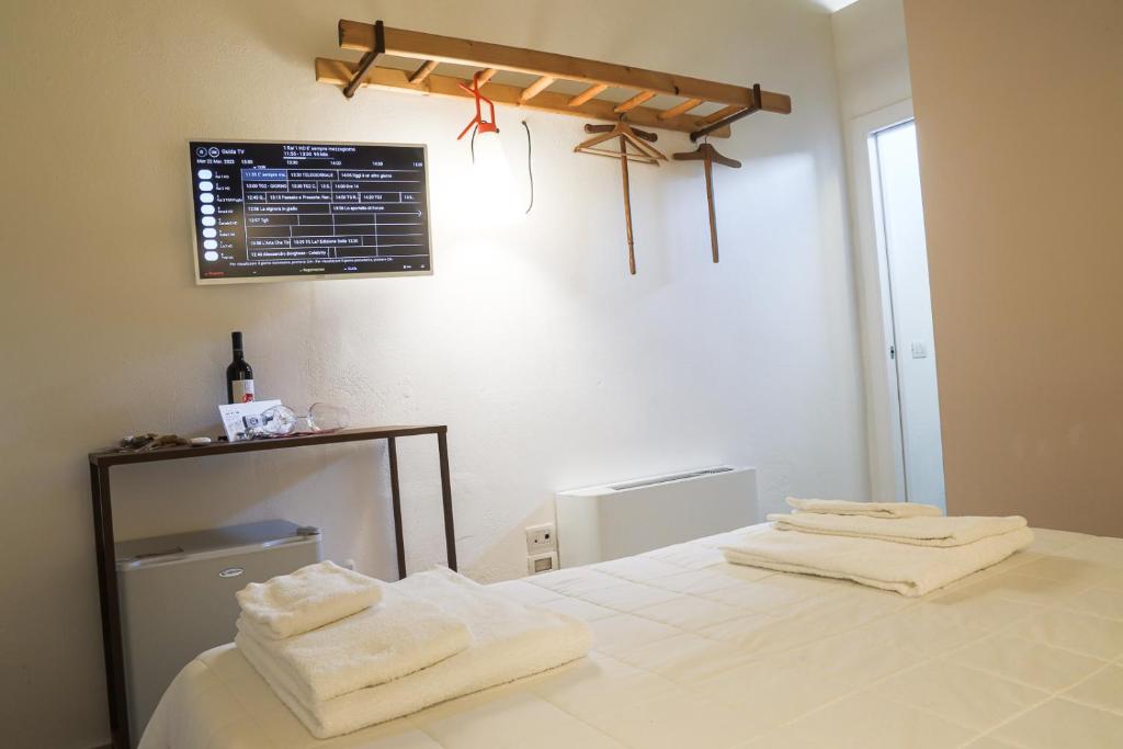 Postel nebo postele na pokoji v ubytování Il Carrubo residenza Walk&Stay