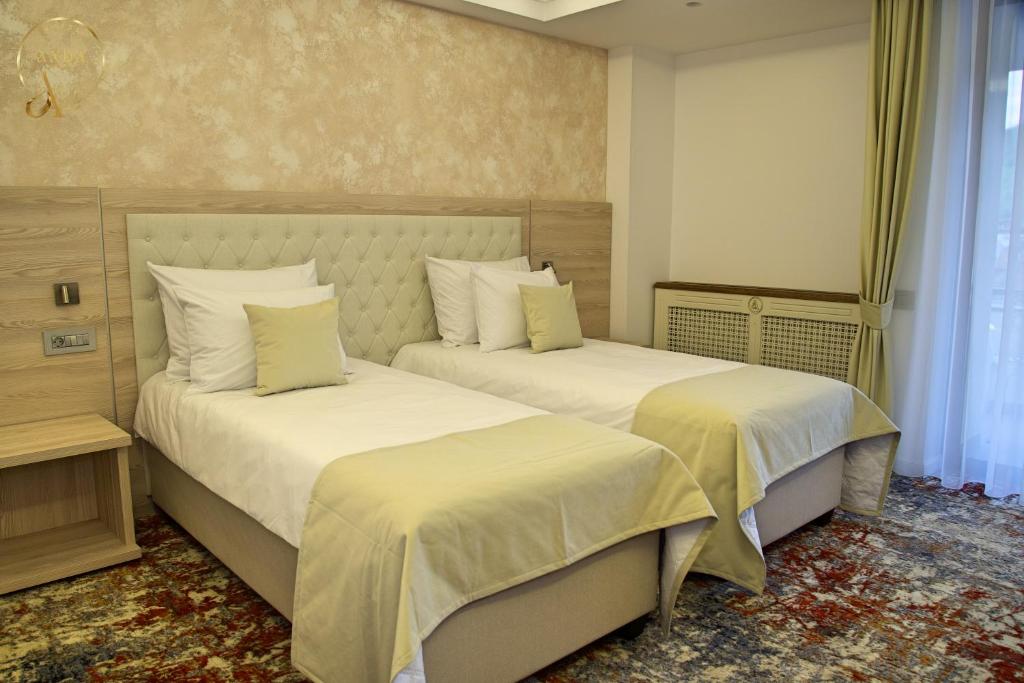 Postel nebo postele na pokoji v ubytování Hotel Anda