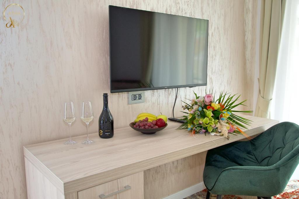 TV a/nebo společenská místnost v ubytování Hotel Anda