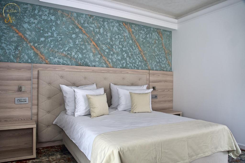 Postel nebo postele na pokoji v ubytování Hotel Anda