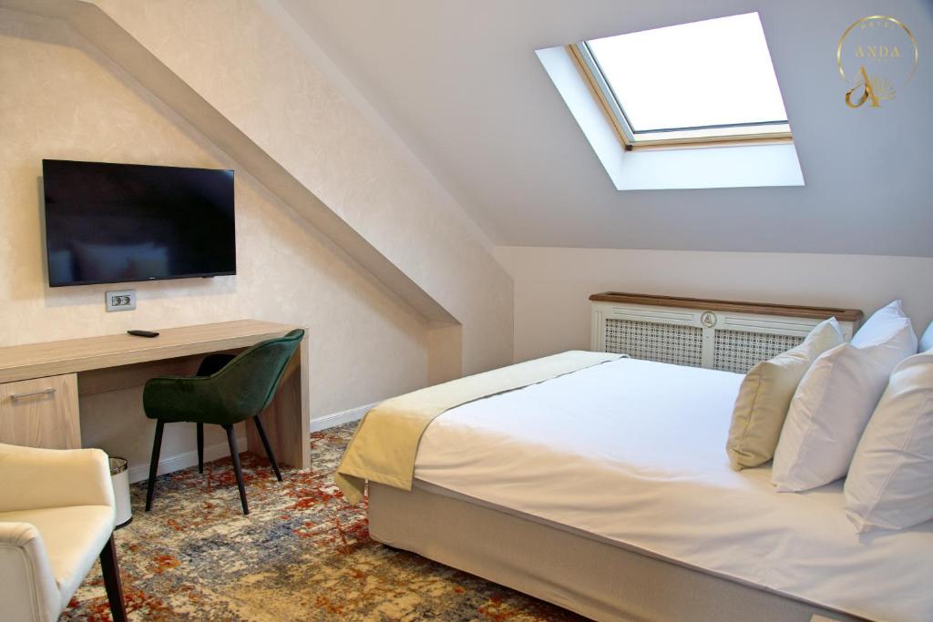 Postel nebo postele na pokoji v ubytování Hotel Anda