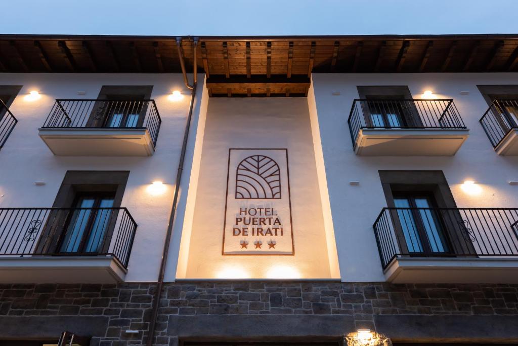 a building with a sign on the side of it at Silken Puerta de Irati in Ochagavía