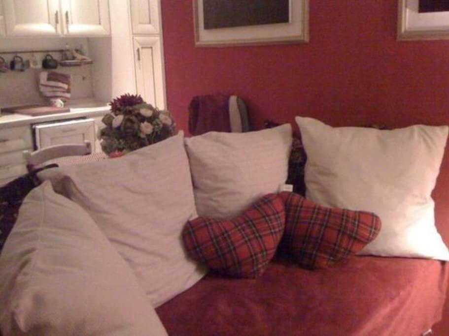 a group of pillows on a couch in a room at Casa Magnolia in Varese