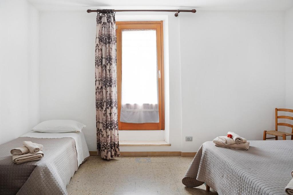 Postel nebo postele na pokoji v ubytování Pin e cele