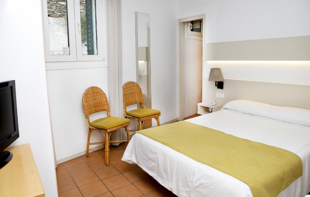 Postel nebo postele na pokoji v ubytování Hotel Ubaldo