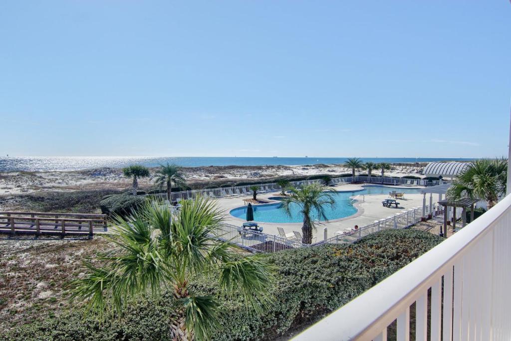 a view of the beach from the balcony of a resort at Gulf Shores Plantation Condos in Gulf Shores
