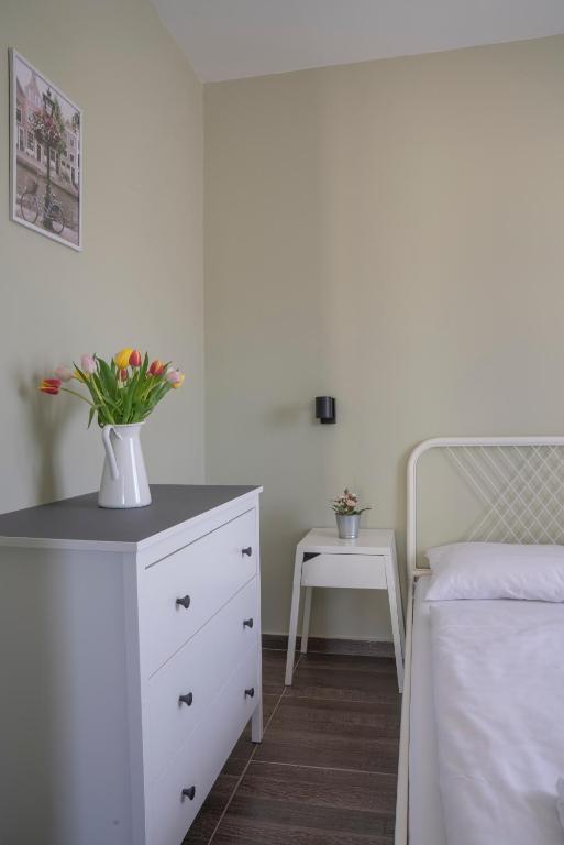 Postel nebo postele na pokoji v ubytování Tulipán Apartman