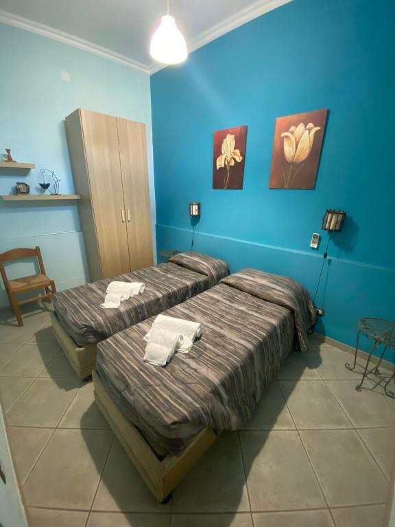 Postel nebo postele na pokoji v ubytování B&B Su Frori Arrubiu