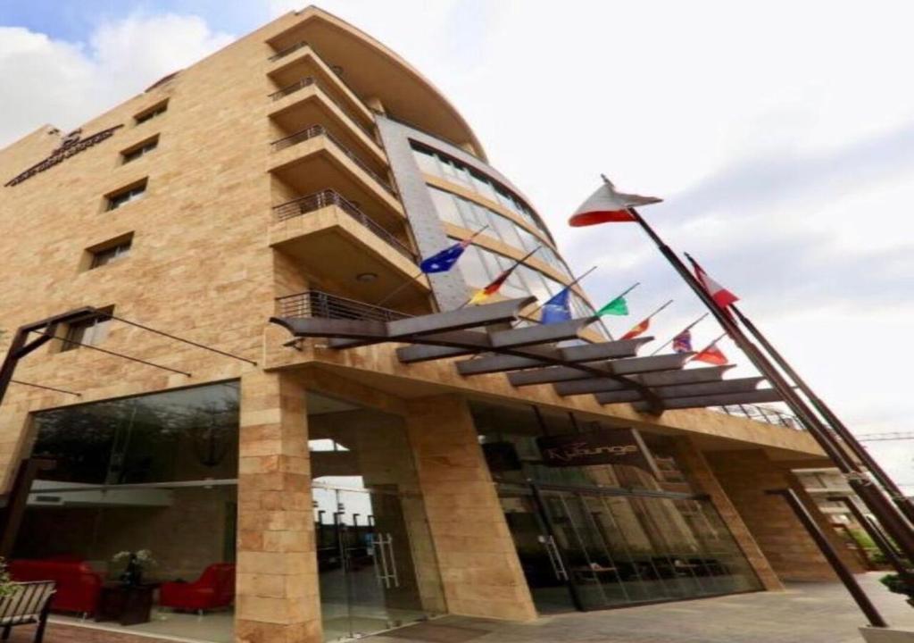 a building with flags in front of it at Jounieh Suites Boutique Hotel in Jounieh