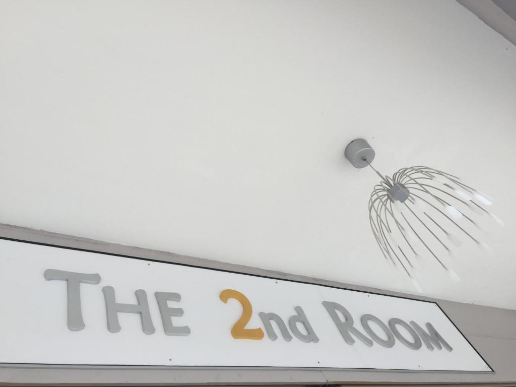 a sign for the room on a ceiling at The Second Room in Ranau