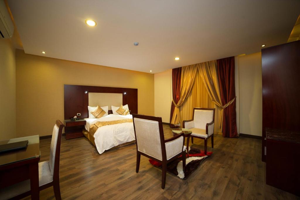 Postel nebo postele na pokoji v ubytování رؤوم إن للشقق الفندقية-Raoum Inn Hotel Apartments