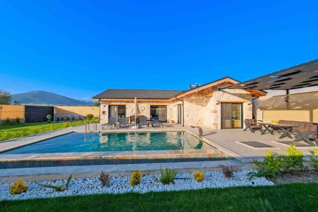 a swimming pool in the yard of a house at Ader villa 3 in Fethiye