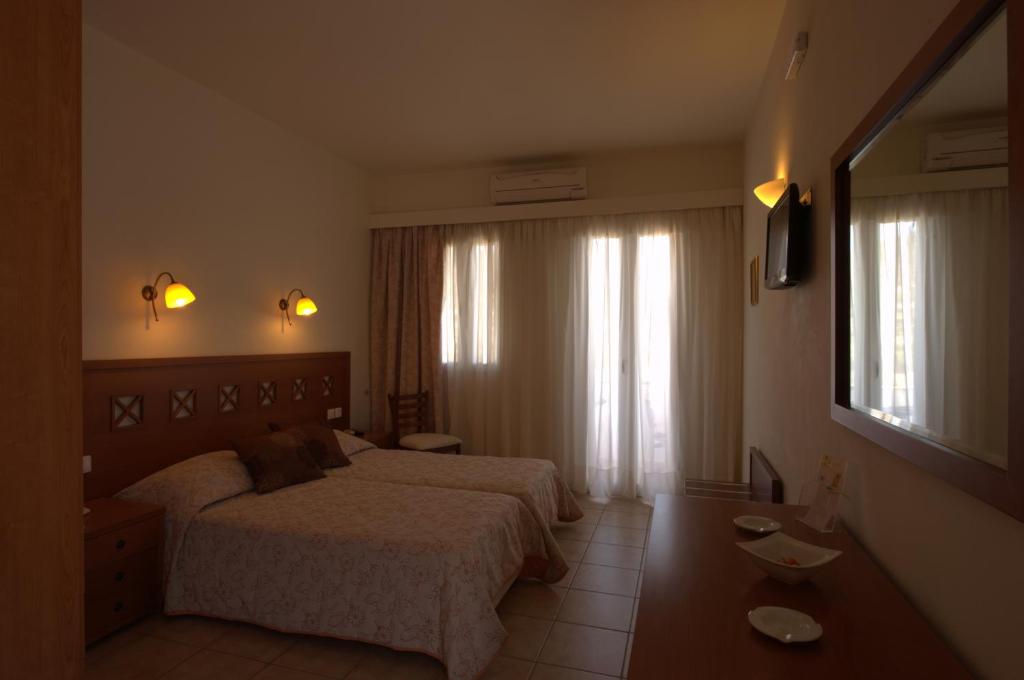 Postel nebo postele na pokoji v ubytování Summer Time - Tinos Apartments