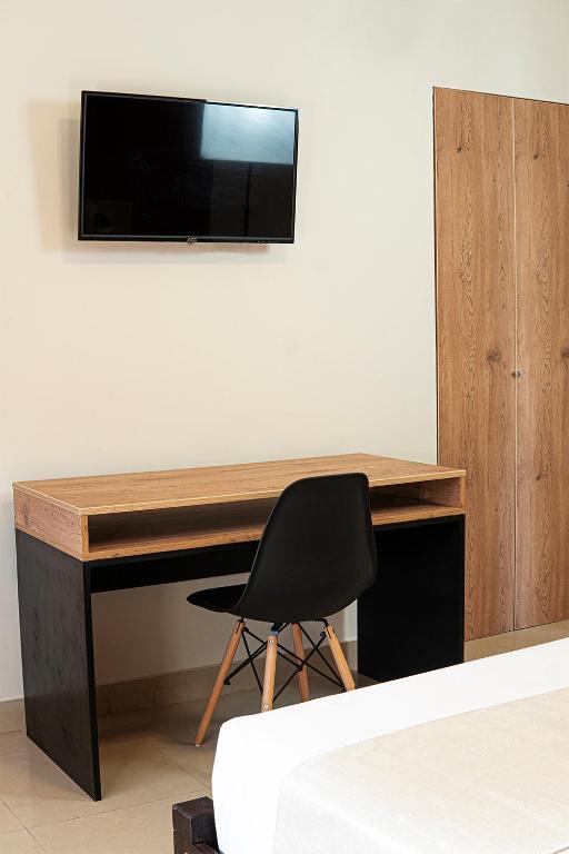 TV a/nebo společenská místnost v ubytování Rua Hoteles Talara