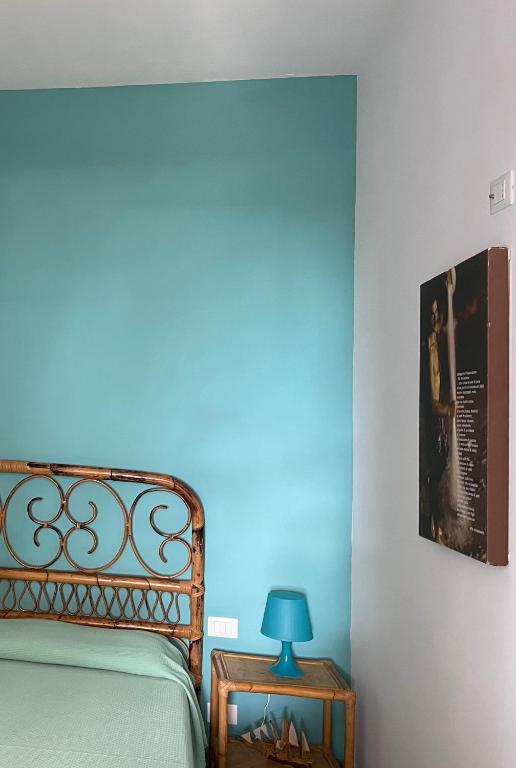 Postel nebo postele na pokoji v ubytování Antonia's Home - casa per le vacanze con giardino e veranda attrezzati