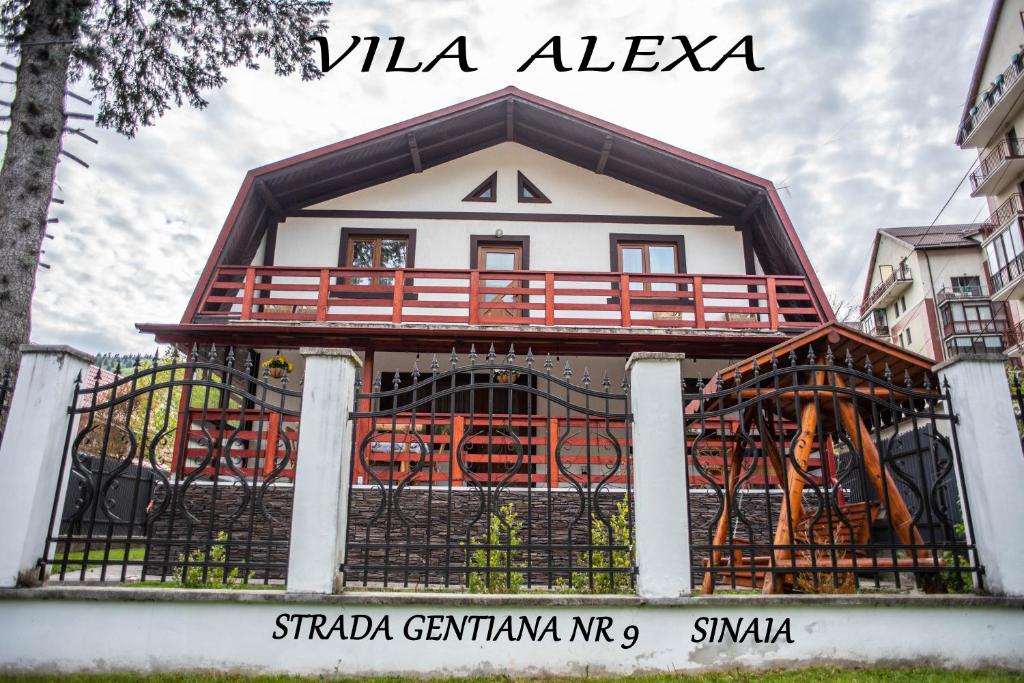 a house with a balcony on top of it at Casa Alexa in Sinaia