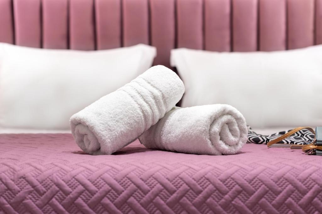 Posteľ alebo postele v izbe v ubytovaní Bella Vasilica Luxury Apartments